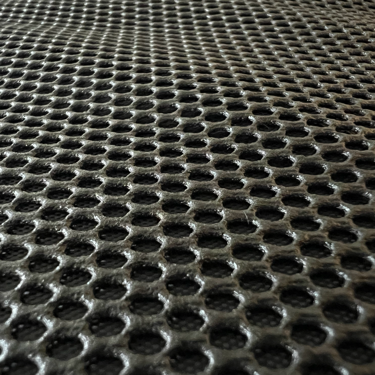 Zoom billede af autostolbeskytterens tekstil