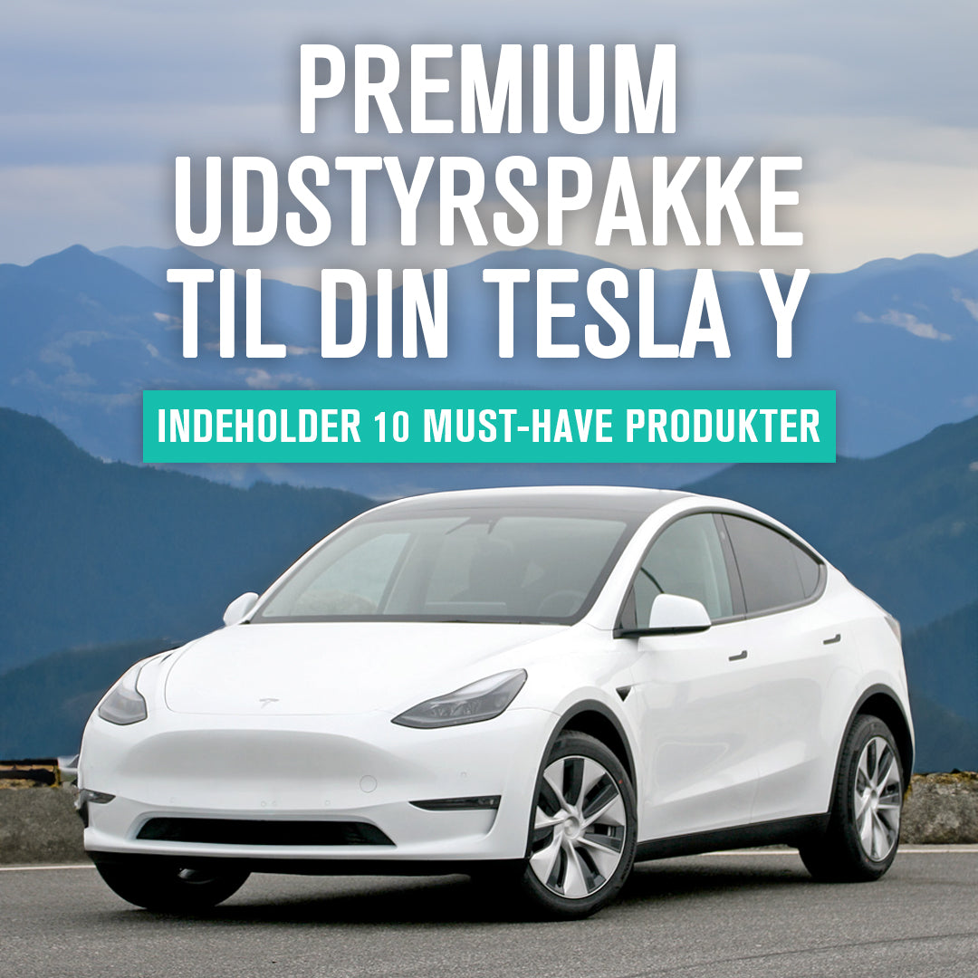 Hvid Tesla Model Y med Premium udstyrspakke, der indeholder 10 must-have produkter.