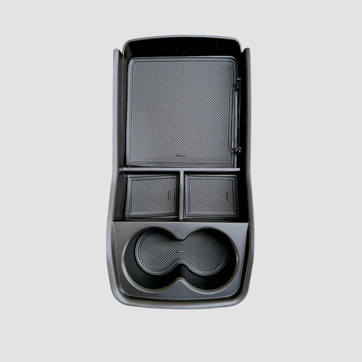 Fritlagt opbevaringsboks til Kia EV9, på en grå baggrund