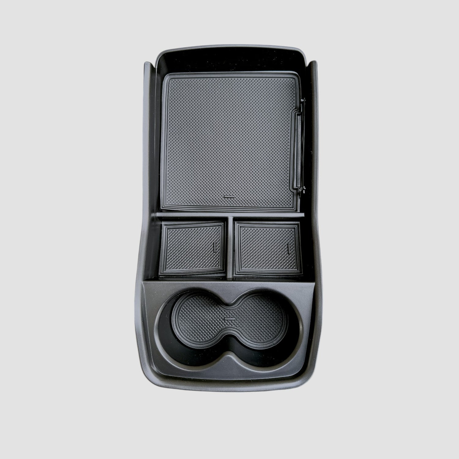 Fritlagt opbevaringsboks til Kia EV9, på en grå baggrund