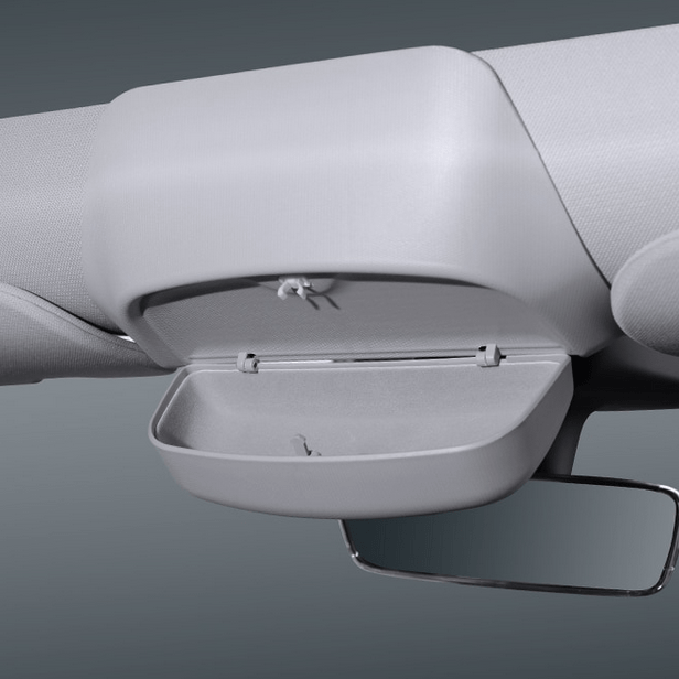 Monteret solbrille holder til tesla som er åben med grå baggrund