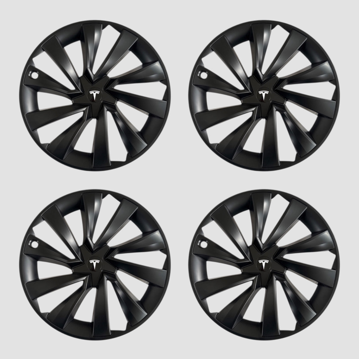 Fire sorte MV Spiral hjulkapsler med Tesla logo til Model Y 2025.