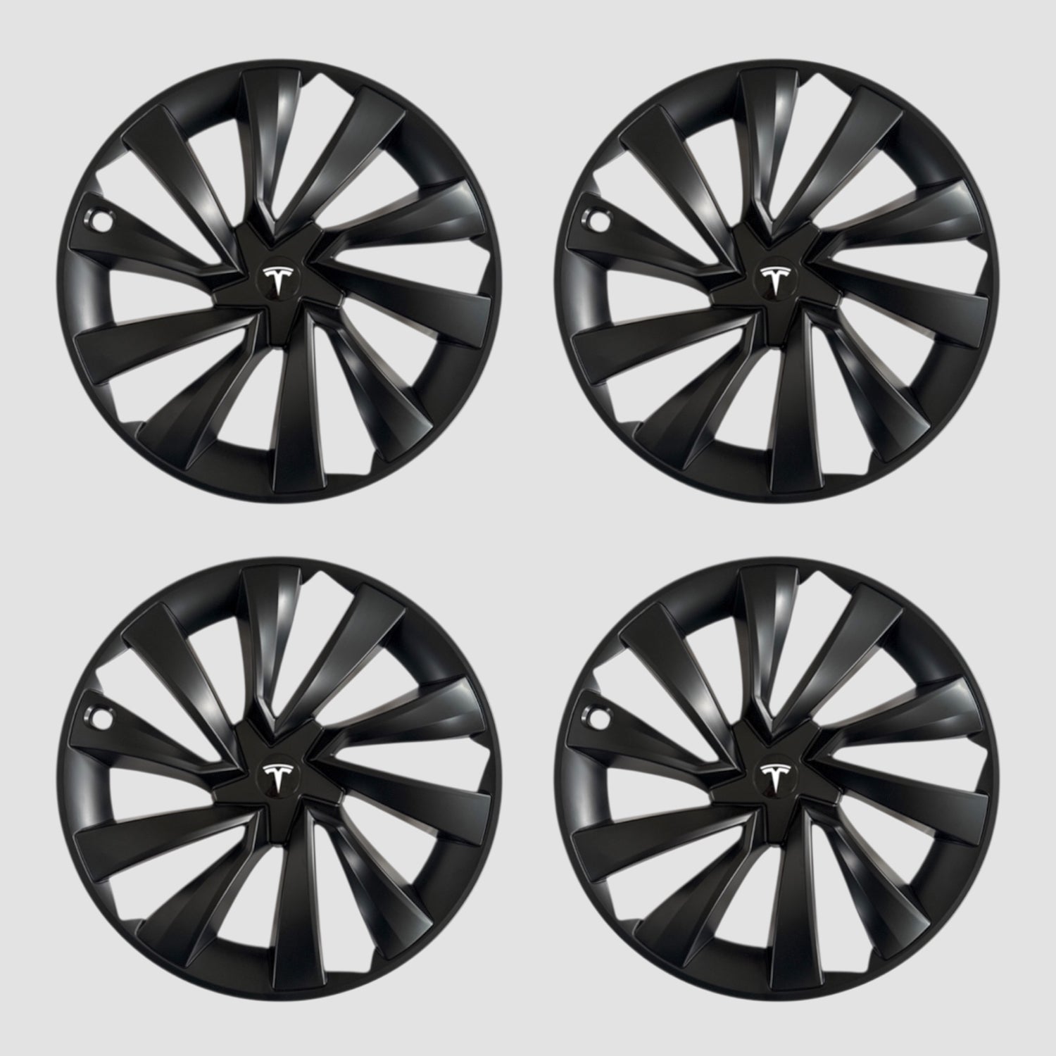 Fire sorte MV Spiral hjulkapsler med Tesla logo til Model Y 2025.