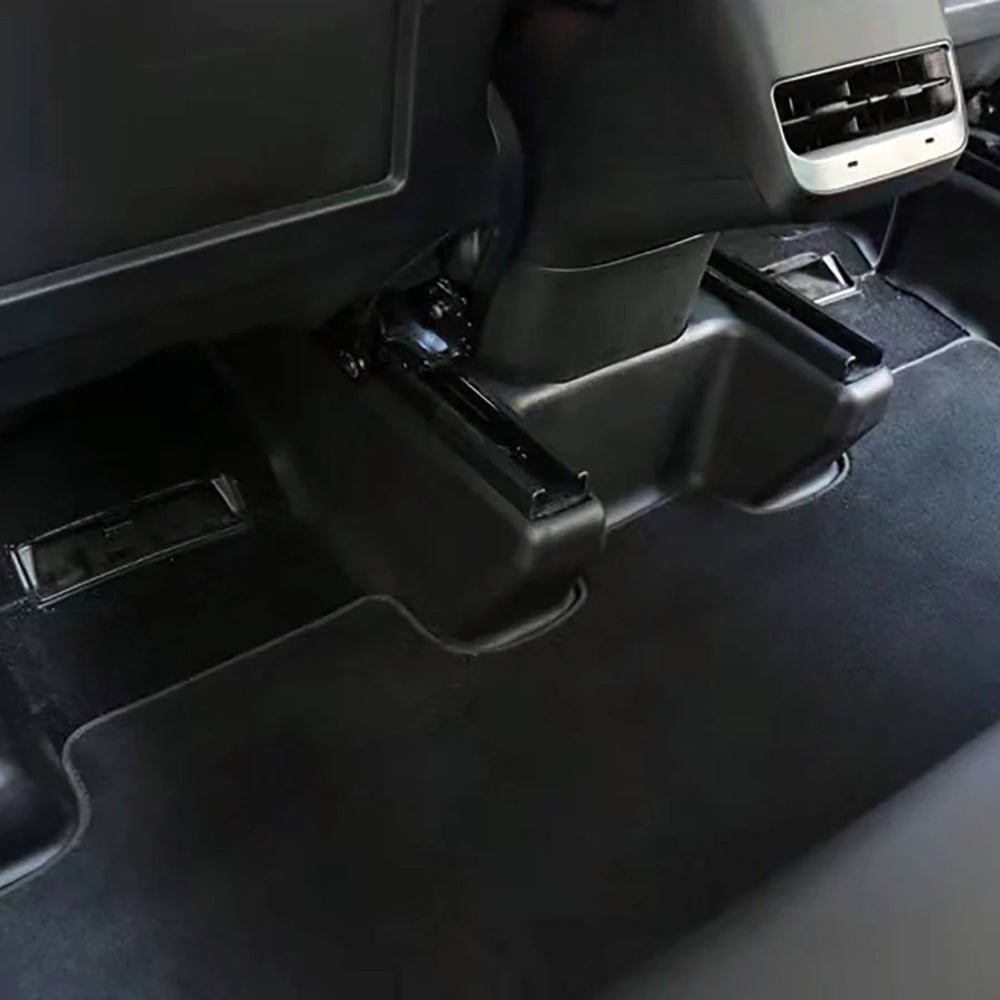 Beskyttere til sædeskinner i en Tesla Model Y.