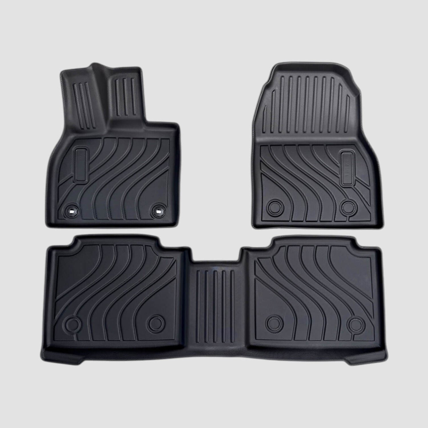 All weather måttesæt til Toyota bZ4X, sorte gummimåtter med mønster, vises på grå baggrund.