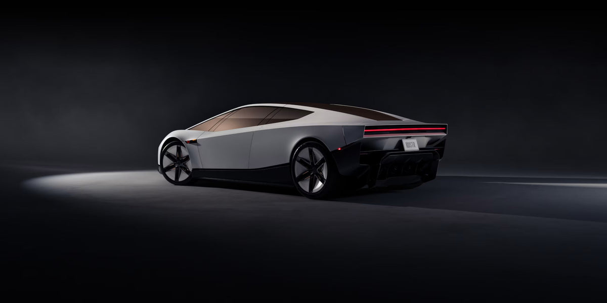 Ny Tesla Roadster 2026 i Performance-udgaven i hvid set skråt forfra i et mørkt studie
