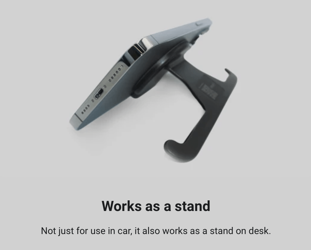 En jowua magnetholder der holder en mobil fast med sin magnet. Teksten beskriver at den også kan bruges som en stander, og ikke kun virker i bilen.