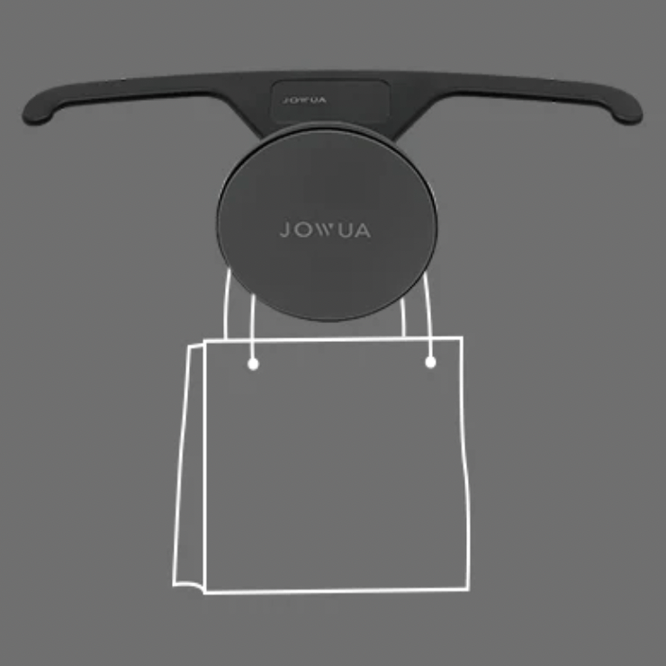 Jowua magnetholder som holder en skitset pose. 