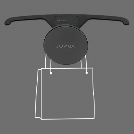 Jowua magnetholder som holder en skitset pose. 