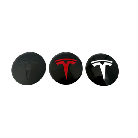 Tre Tesla centerkapsler i sort, rød og hvid til fælge.