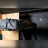 Moby Mountain telt lift med tagtelt i overtræk hævet op i garage