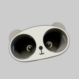 En kop holder som ligner en panda . En sjov kop holder at have i bilen. 
