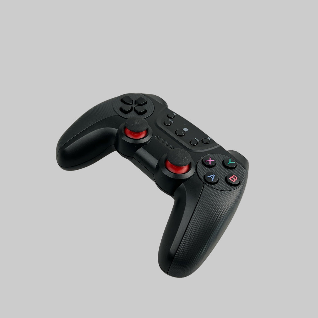 En trådløs controller i farven sort, som kan bruges i Tesla