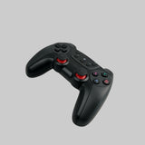 En trådløs controller i farven sort, som kan bruges i Tesla